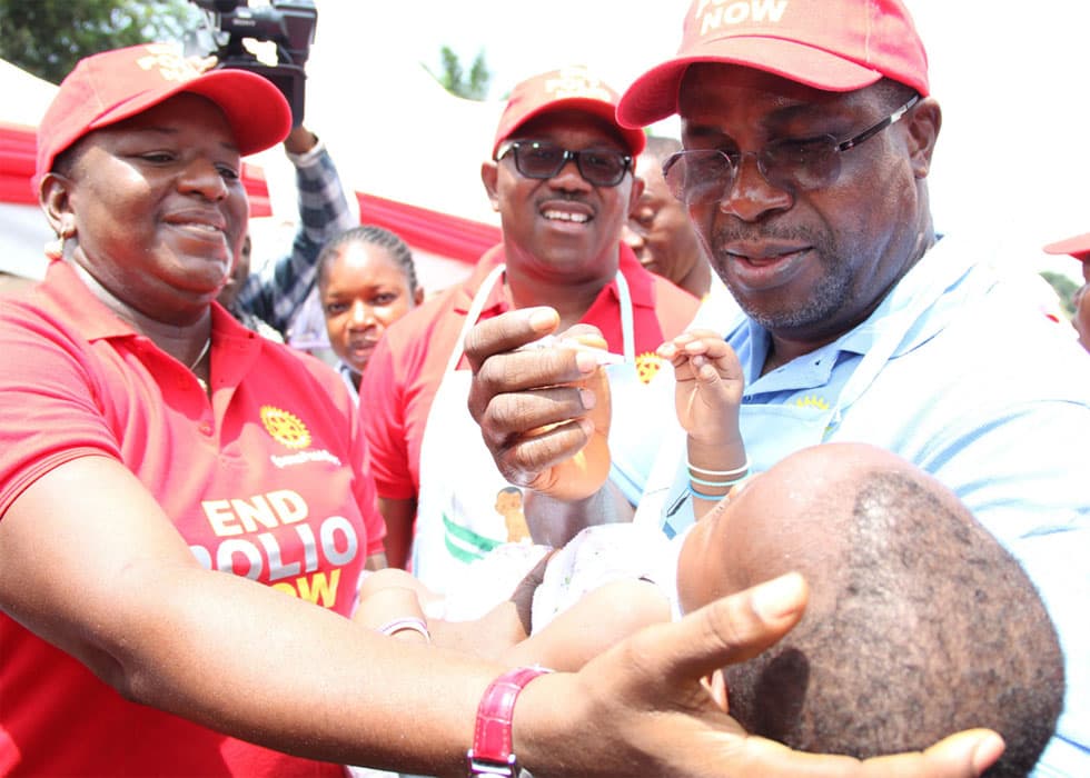 Sir Emeka Offor administering the polio vaccine to a child during National Immunization Days in Nigeria